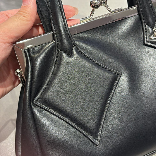 Versatile handbag with a slanted strap