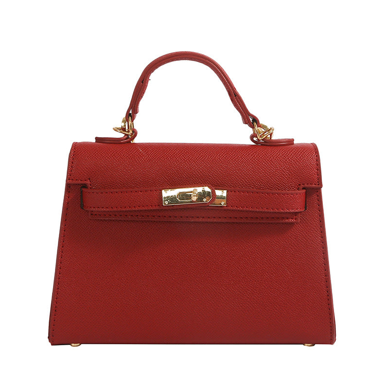 Textured snap closure handbag in small size