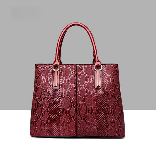 Leather snake-pattern handbag