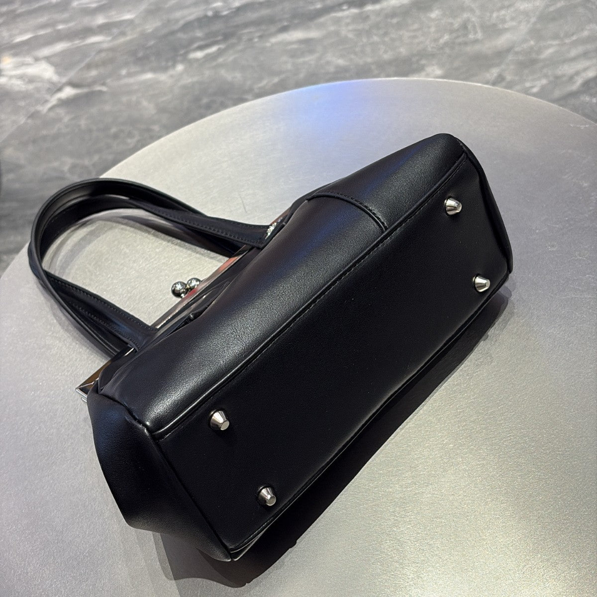 Versatile handbag with a slanted strap