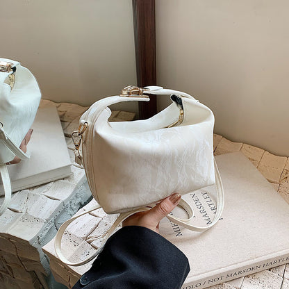 High-end handbag with a small square shape