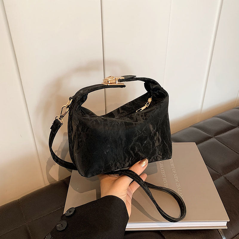 High-end handbag with a small square shape