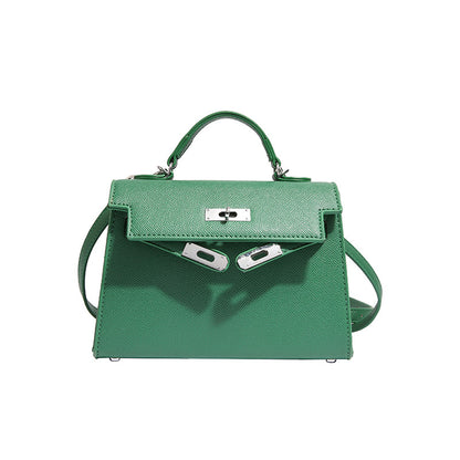 Textured snap closure handbag in small size