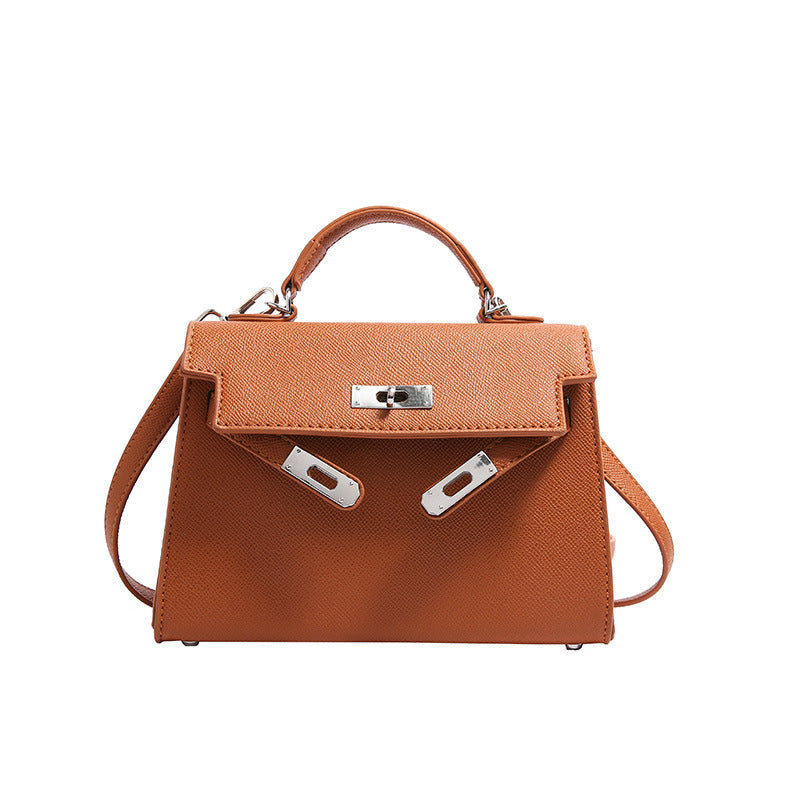 Textured snap closure handbag in small size