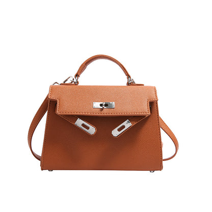 Textured snap closure handbag in small size