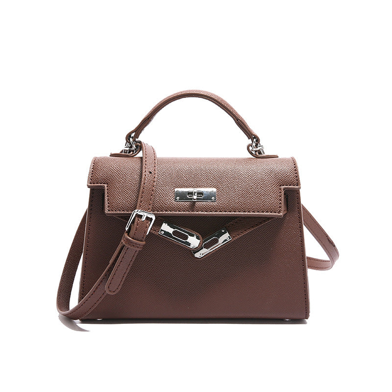 Textured snap closure handbag in small size