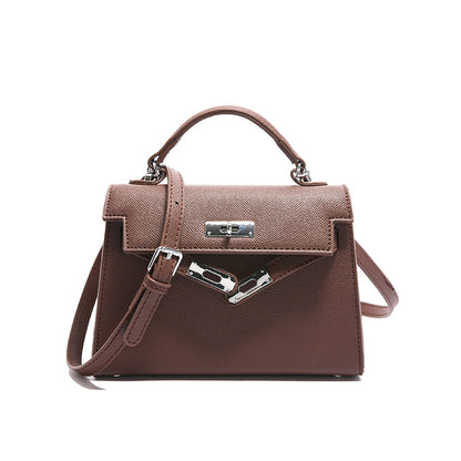 Textured snap closure handbag in small size