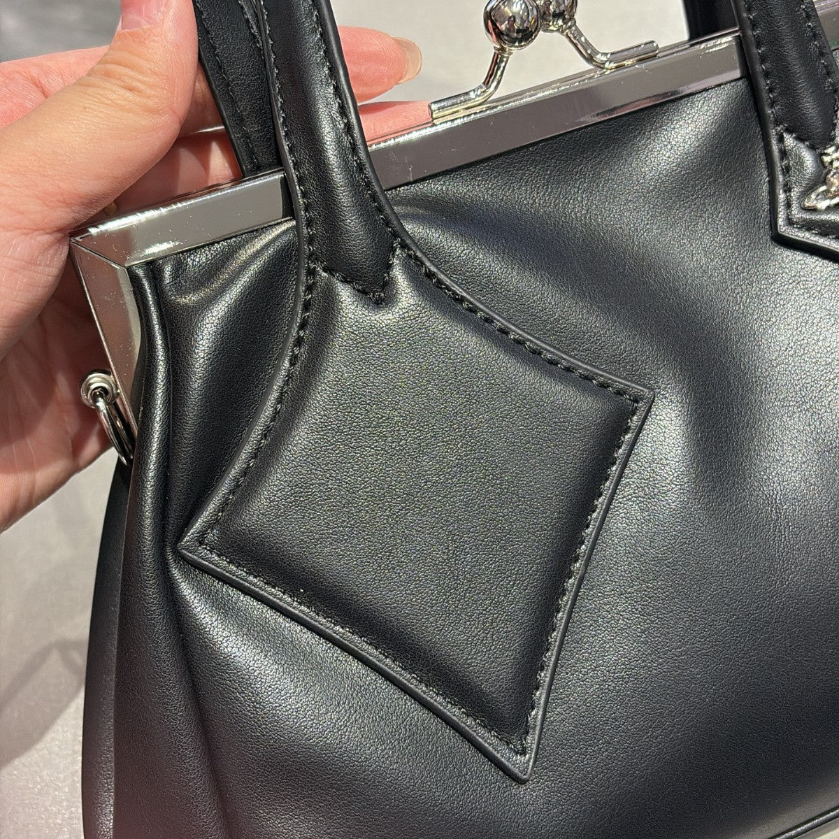 Versatile handbag with a slanted strap