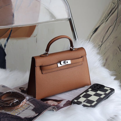 A fashionable women's handbag with a one-shoulder crossbody strap