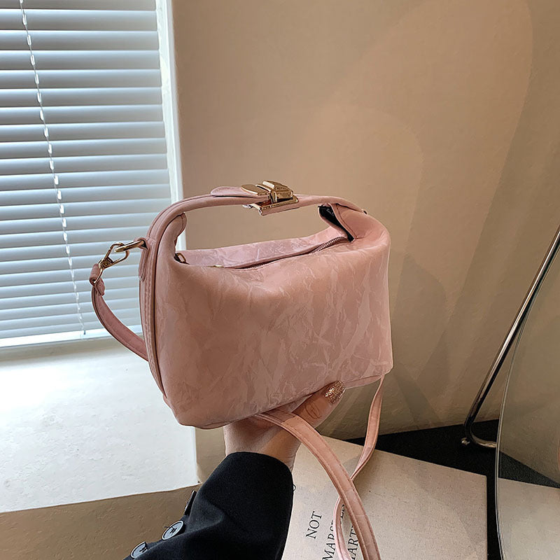 High-end handbag with a small square shape