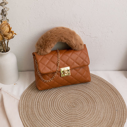 Diamond-patterned fuzzy handbag