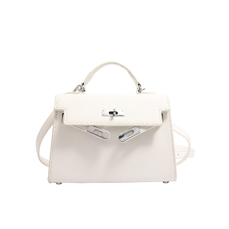 Textured snap closure handbag in small size