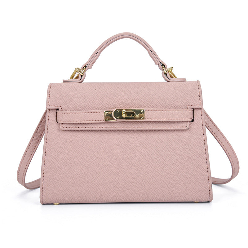 Textured snap closure handbag in small size