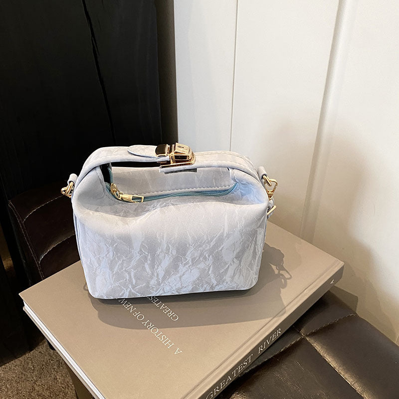 High-end handbag with a small square shape