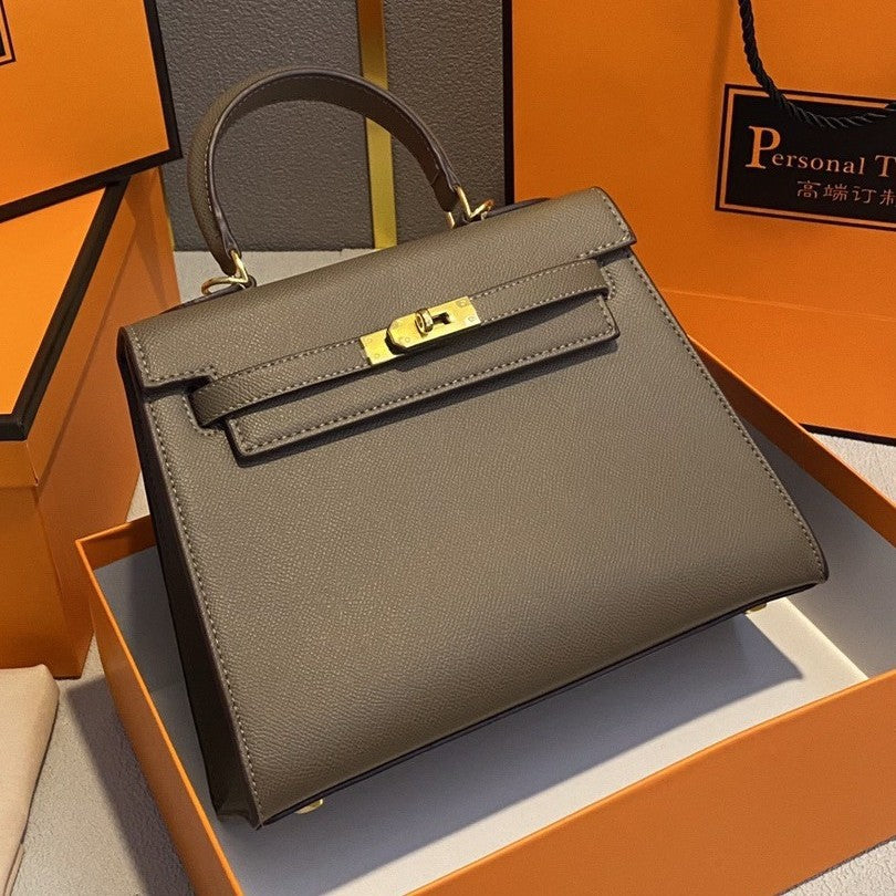 A fashionable women's handbag with a one-shoulder crossbody strap