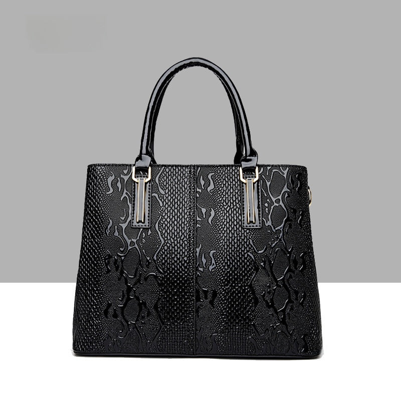Leather snake-pattern handbag