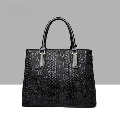 Leather snake-pattern handbag