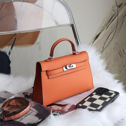 A fashionable women's handbag with a one-shoulder crossbody strap