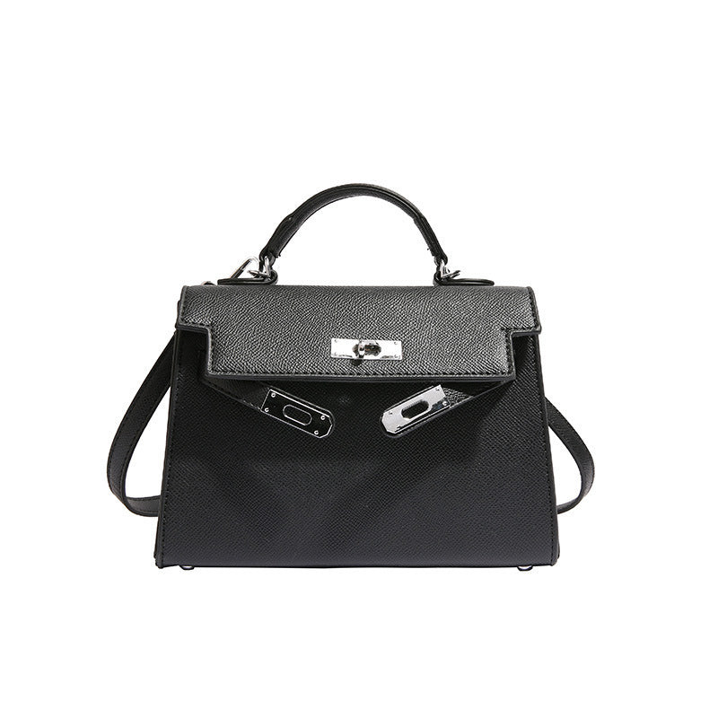Textured snap closure handbag in small size