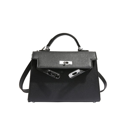 Textured snap closure handbag in small size