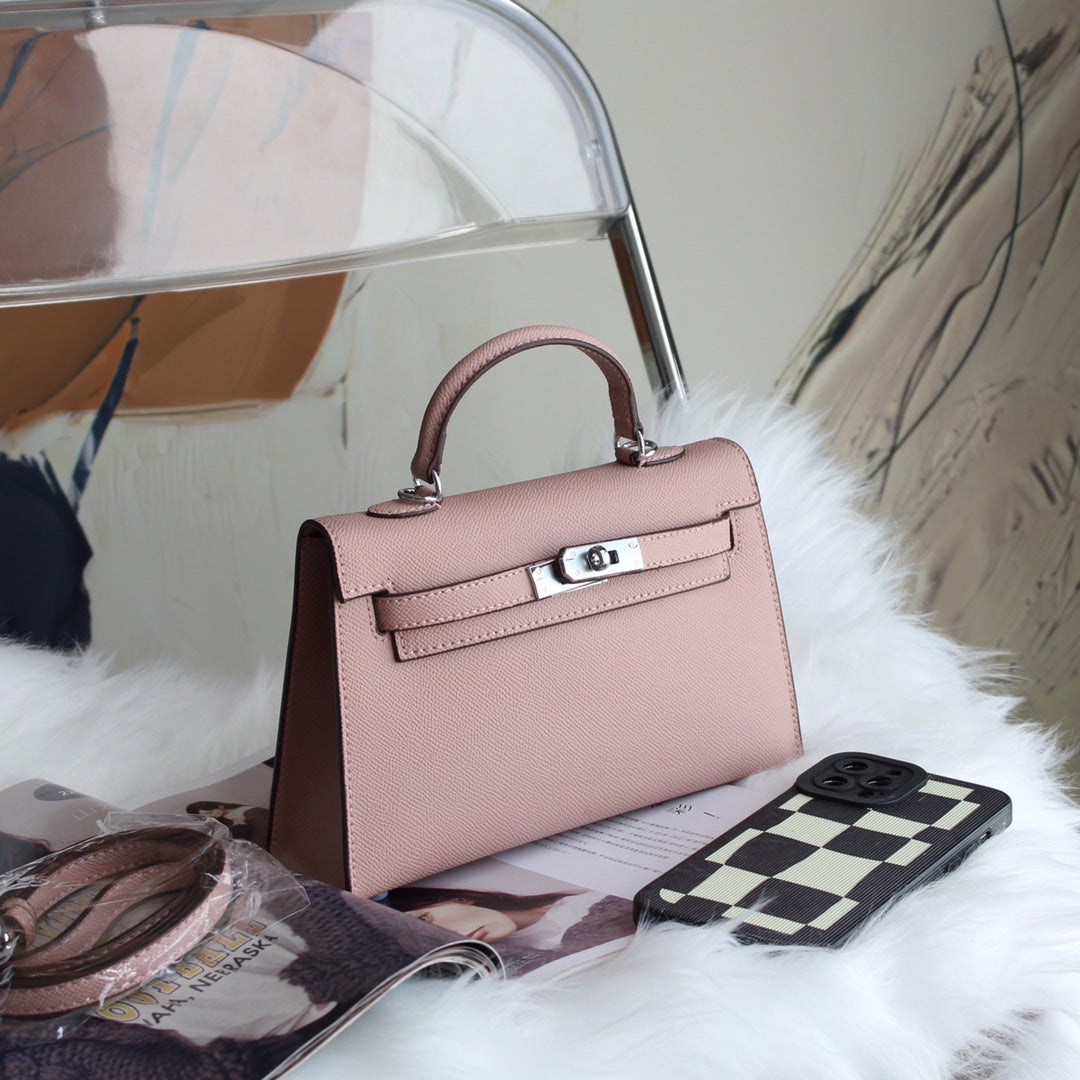 A fashionable women's handbag with a one-shoulder crossbody strap