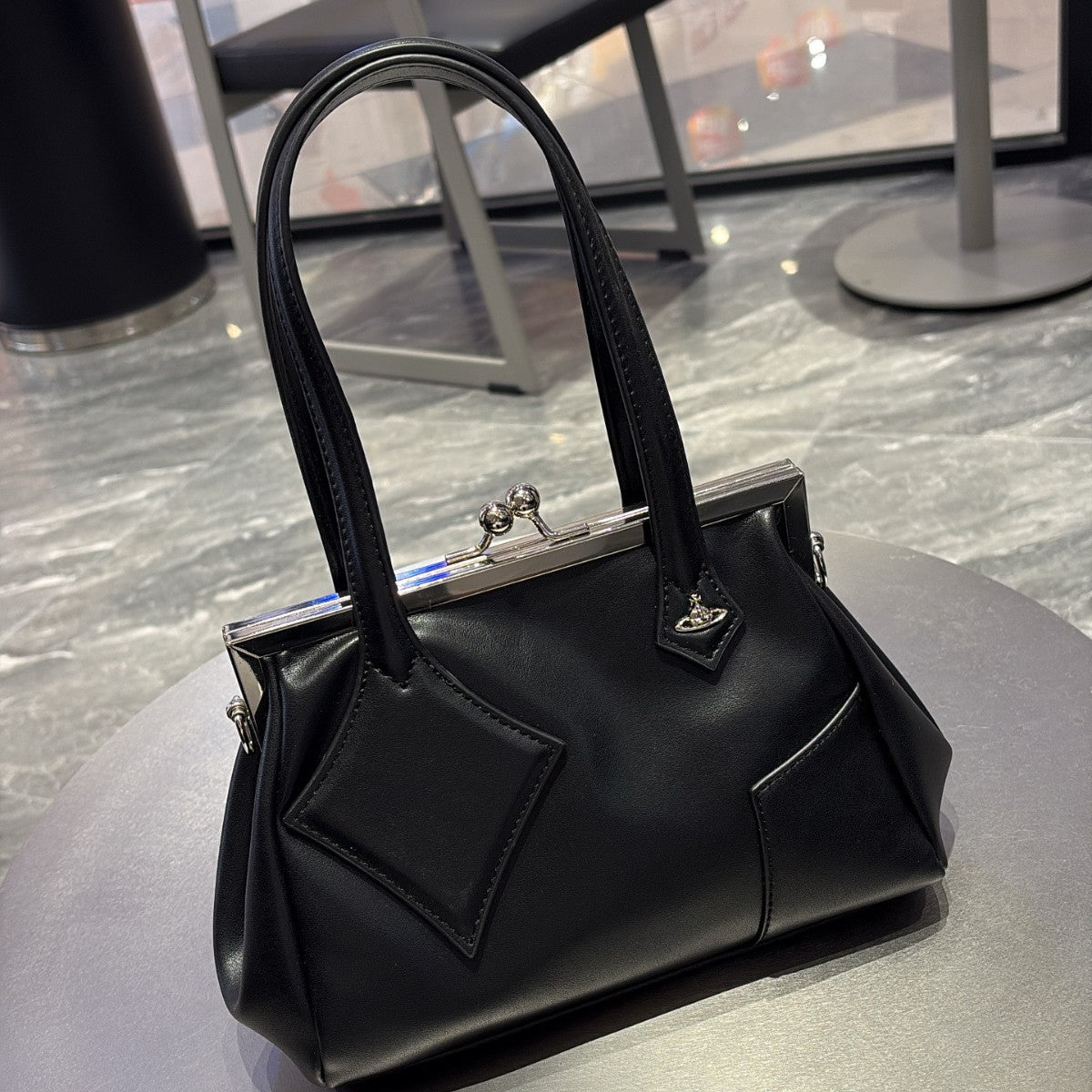 Versatile handbag with a slanted strap
