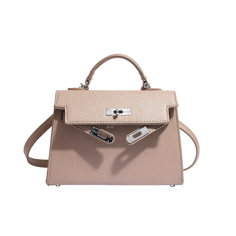 Textured snap closure handbag in small size