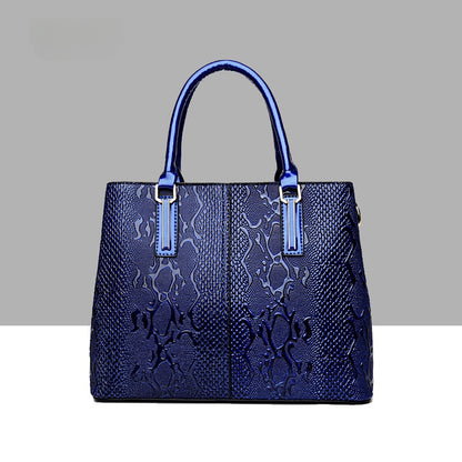 Leather snake-pattern handbag